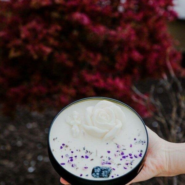 Hand-poured soy wax candles with dried flowers and essential oils crafted in a candle making session.