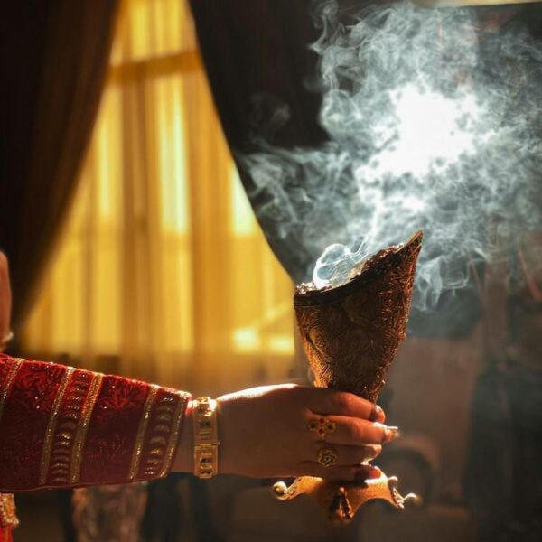 Traditional dukhoon incense being prepared with aromatic ingredients in a cultural workshop.