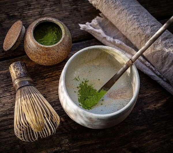 Whisking ceremonial matcha in a traditional Japanese tea bowl