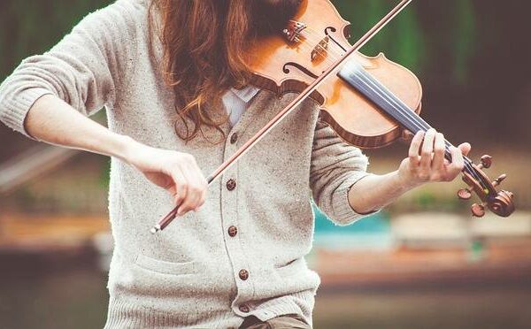Student practicing violin during a private music workshop in Abu Dhabi.